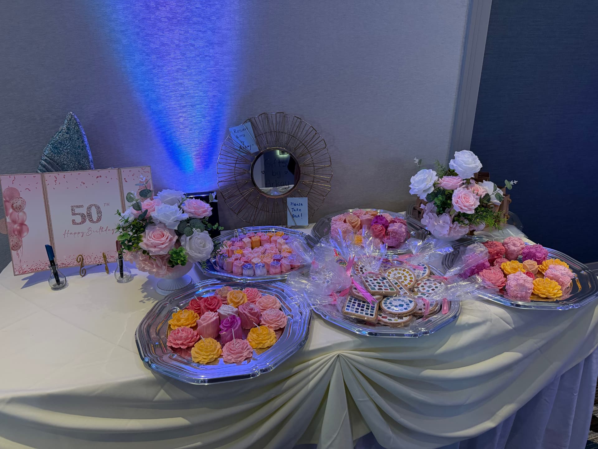 Arkay's flower candles and mosaic coasters at a birthday celebration